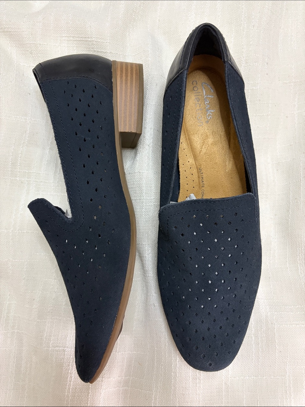 Clarks Navy Perforated Slip-On Loafers with Tan Heel